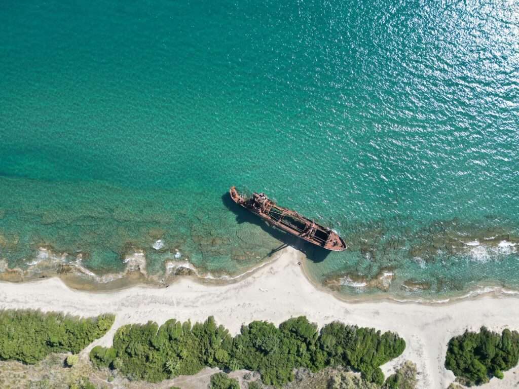 a shipwreck by a shore